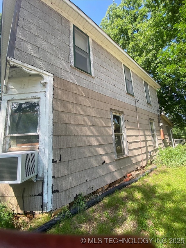 103 S Dunlap St, Cleveland, OK 74020 - view of side of home featuring cooling unit