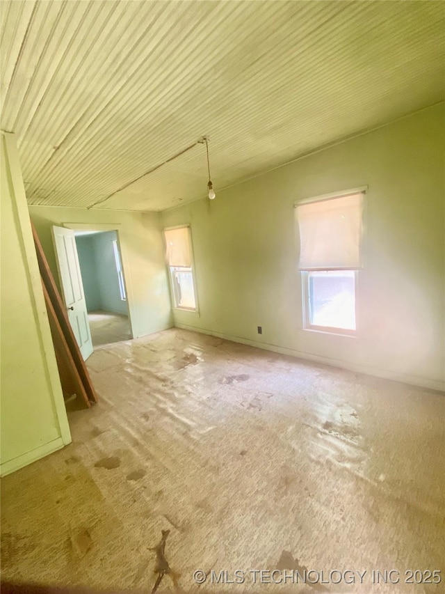 103 S Dunlap St, Cleveland, OK 74020 - carpeted empty room with healthy amount of natural light