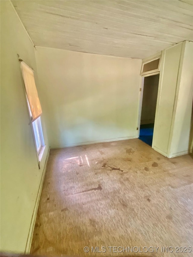 103 S Dunlap St, Cleveland, OK 74020 - carpeted spare room with baseboards