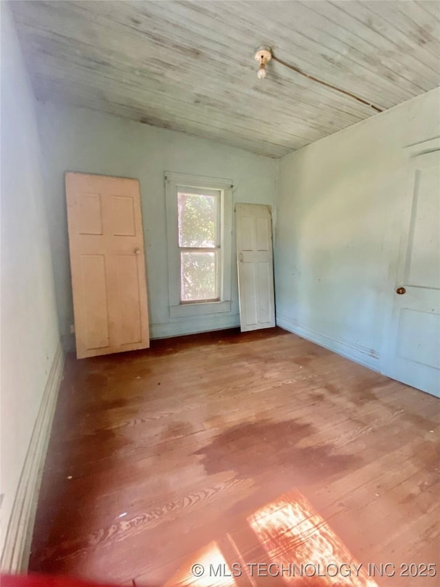 103 S Dunlap St, Cleveland, OK 74020 - spare room with wood finished floors and baseboards