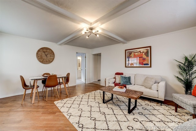 3527 E 4th Pl, Tulsa, OK 74112 - living room featuring beamed ceiling, wood finished floors, and a chandelier