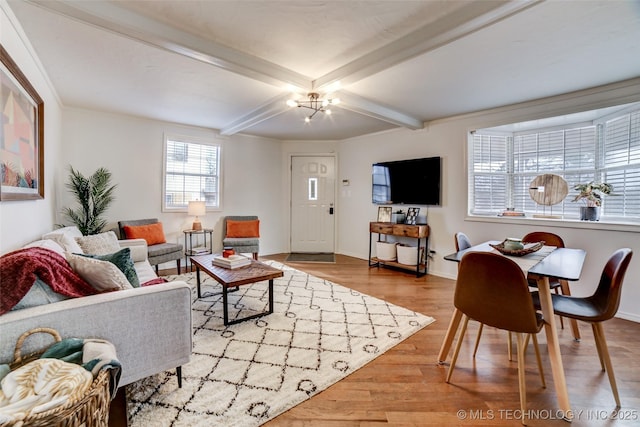 3527 E 4th Pl, Tulsa, OK 74112 - living area with wood finished floors, beam ceiling, and a chandelier