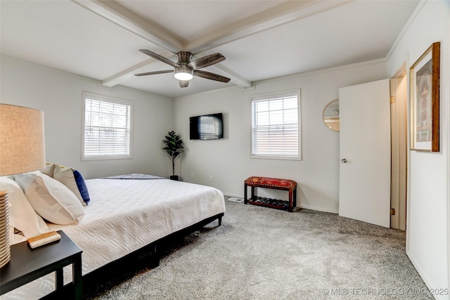 3527 E 4th Pl, Tulsa, OK 74112 - carpeted bedroom with multiple windows, beamed ceiling, and ceiling fan