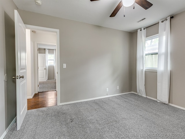3609 Dana Dr, Bartlesville, OK 74006 - carpeted empty room featuring ceiling fan, plenty of natural light, and a smoke detector