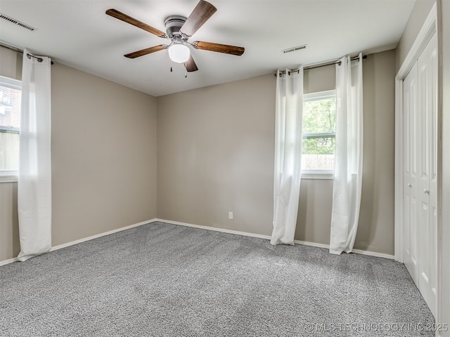 3609 Dana Dr, Bartlesville, OK 74006 - unfurnished bedroom with carpet flooring, a closet, and ceiling fan