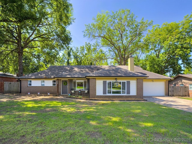 3609 Dana Dr, Bartlesville, OK 74006 - ranch-style house with brick siding, a garage, driveway, and a chimney
