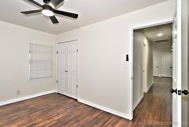 4636 E Independence St, Tulsa, OK 74115 - unfurnished bedroom featuring attic access, wood finished floors, a closet, and a ceiling fan