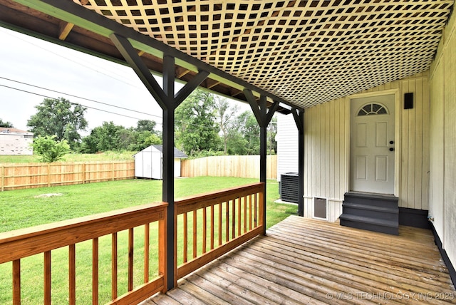 4636 E Independence St, Tulsa, OK 74115 - wooden terrace with a fenced backyard, a shed, and entry steps
