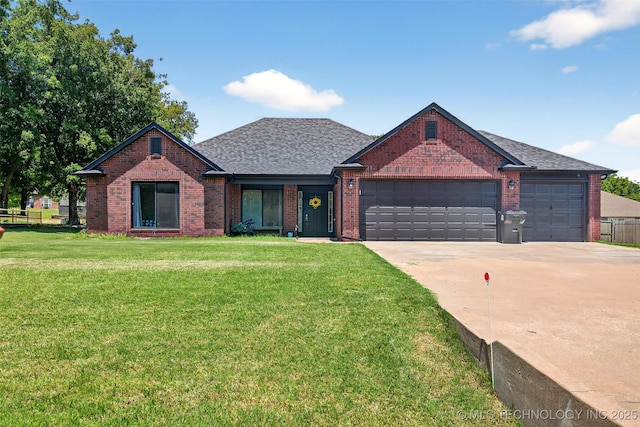 8813 E 104th Pl N, Owasso, OK 74055 - traditional-style house with an attached garage, driveway, brick siding, and a shingled roof