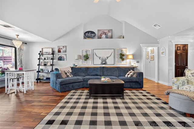 8813 E 104th Pl N, Owasso, OK 74055 - living room featuring wood finished floors and high vaulted ceiling