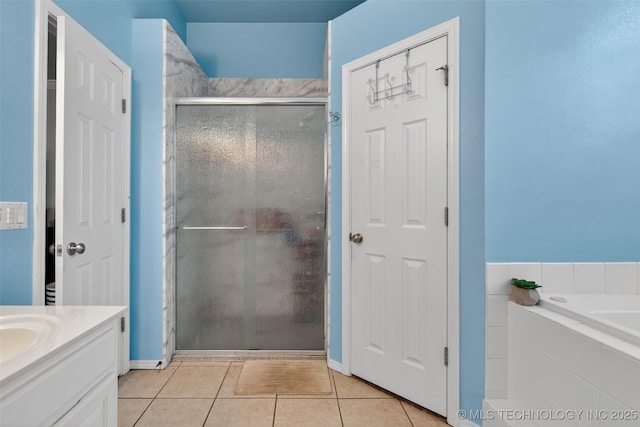 8813 E 104th Pl N, Owasso, OK 74055 - full bathroom with a stall shower, tile patterned floors, vanity, and a bath