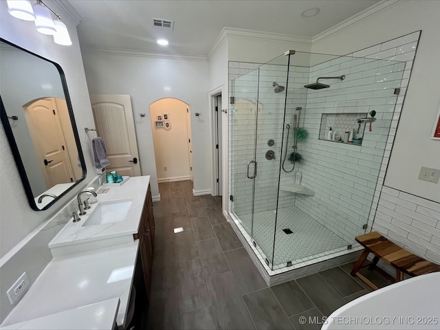 239 E 117th St S, Jenks, OK 74037 - bathroom featuring a shower stall, ornamental molding, vanity, and a freestanding tub