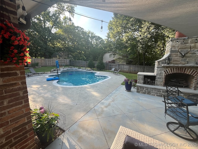 239 E 117th St S, Jenks, OK 74037 - view of pool featuring an outdoor stone fireplace, a patio area, and a fenced backyard