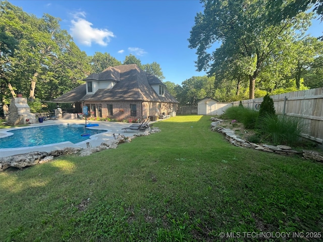 239 E 117th St S, Jenks, OK 74037 - view of pool featuring a fenced backyard, a patio, and a storage unit