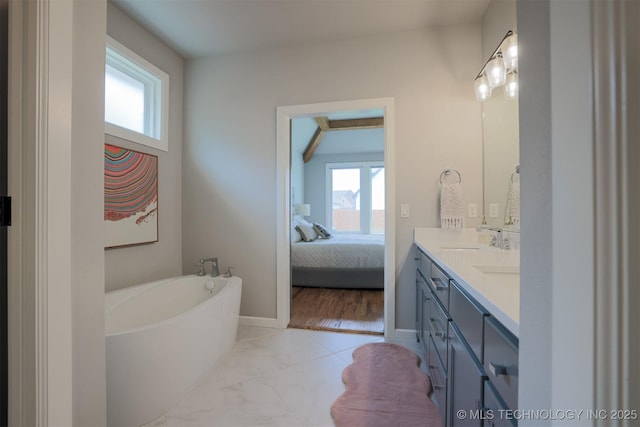 5312 E 124th Pl S, Bixby, OK 74008 - full bath with double vanity, healthy amount of natural light, a garden tub, and ensuite bathroom