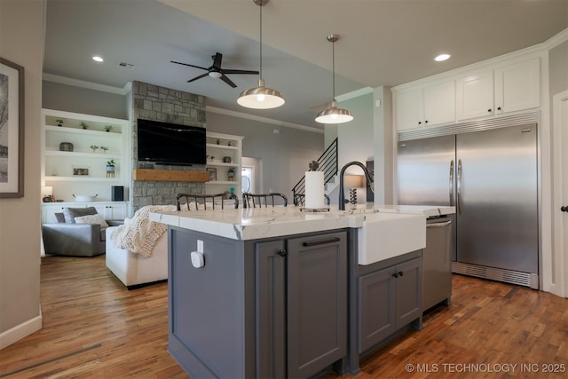 5312 E 124th Pl S, Bixby, OK 74008 - kitchen with crown molding, gray cabinetry, appliances with stainless steel finishes, a ceiling fan, and open floor plan