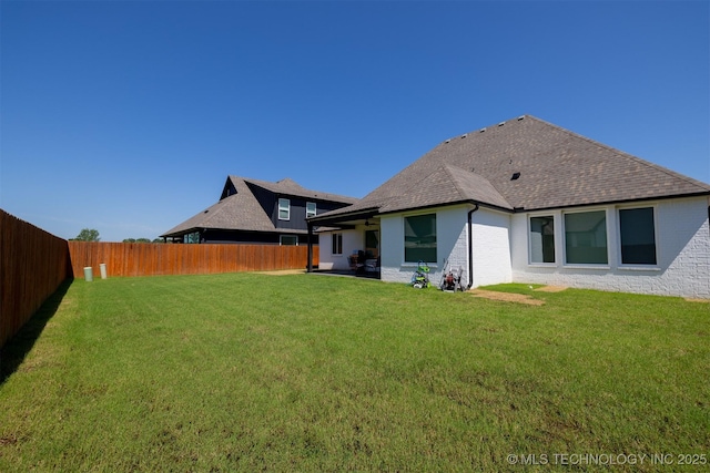 5312 E 124th Pl S, Bixby, OK 74008 - rear view of property with a fenced backyard, roof with shingles, and brick siding