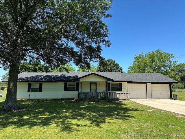 109948 S 4155, Checotah, OK 74426 - ranch-style home featuring an attached garage, concrete driveway, a front yard, and covered porch