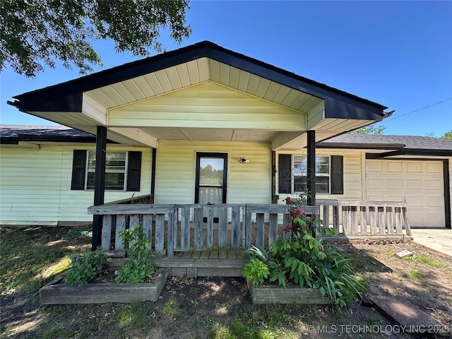 109948 S 4155, Checotah, OK 74426 - view of front of house featuring covered porch and a garage