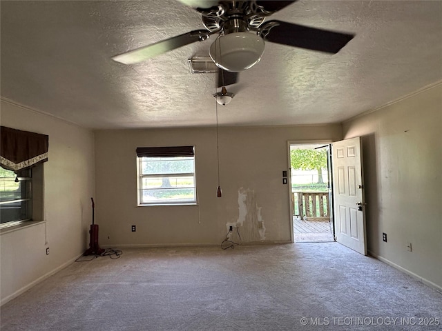 109948 S 4155, Checotah, OK 74426 - unfurnished living room featuring a ceiling fan, carpet flooring, and a textured ceiling