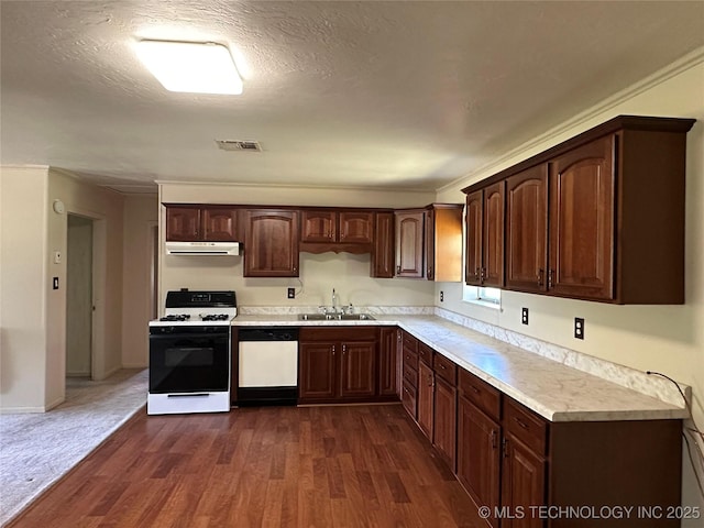 109948 S 4155, Checotah, OK 74426 - kitchen featuring white appliances, under cabinet range hood, light countertops, dark wood-type flooring, and dark brown cabinets