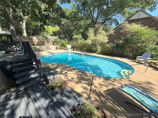 2501 Cherokee Hills Pl, Bartlesville, OK 74006 - view of swimming pool with a deck, a fenced backyard, and a patio