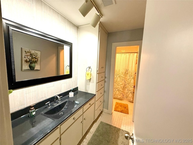 2501 Cherokee Hills Pl, Bartlesville, OK 74006 - bathroom featuring tile patterned floors, vanity, track lighting, and curtained shower