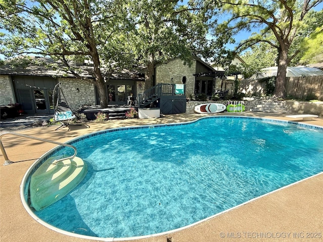 2501 Cherokee Hills Pl, Bartlesville, OK 74006 - view of swimming pool with french doors and a patio
