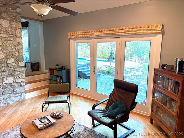 2501 Cherokee Hills Pl, Bartlesville, OK 74006 - sitting room featuring light wood-type flooring, a ceiling fan, and french doors