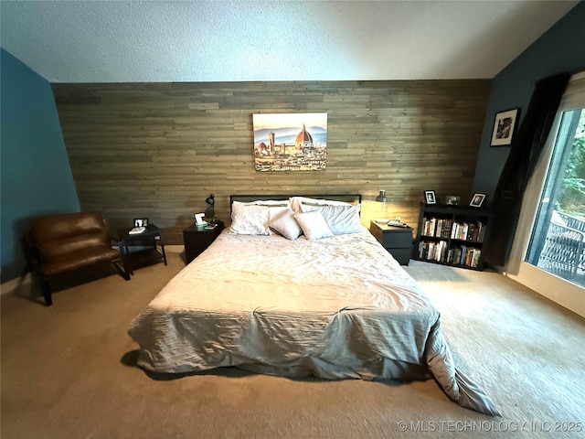 2501 Cherokee Hills Pl, Bartlesville, OK 74006 - carpeted bedroom featuring wooden walls and lofted ceiling