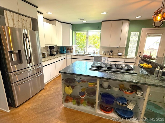 2501 Cherokee Hills Pl, Bartlesville, OK 74006 - kitchen featuring appliances with stainless steel finishes, white cabinetry, open shelves, decorative backsplash, and recessed lighting