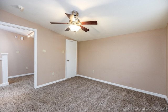 609 Lakeshore Dr, Durant, OK 74701 - unfurnished bedroom with carpet flooring, lofted ceiling, and ceiling fan