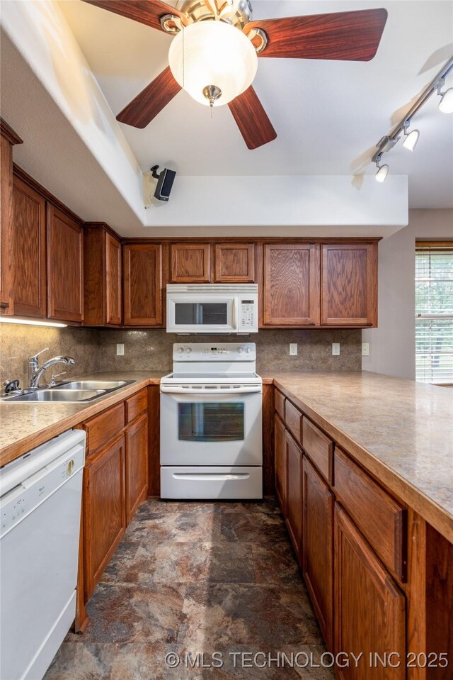 609 Lakeshore Dr, Durant, OK 74701 - kitchen with white appliances, stone finish flooring, decorative backsplash, and brown cabinetry