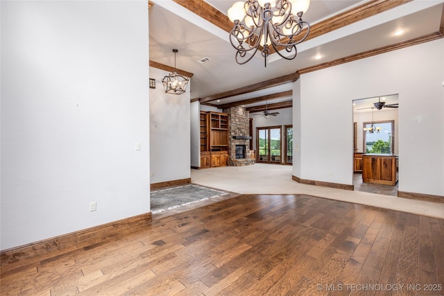 609 Lakeshore Dr, Durant, OK 74701 - unfurnished living room with a chandelier, hardwood / wood-style flooring, a ceiling fan, beamed ceiling, and a fireplace