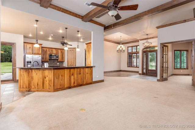 609 Lakeshore Dr, Durant, OK 74701 - kitchen featuring appliances with stainless steel finishes, ceiling fan, beamed ceiling, tasteful backsplash, and a chandelier