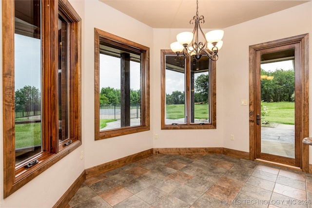 609 Lakeshore Dr, Durant, OK 74701 - unfurnished dining area with a chandelier and stone tile flooring