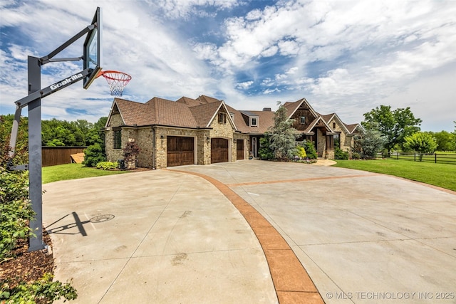 13533 S Lewis Ave, Bixby, OK 74008 - view of front of property with stone siding, concrete driveway, and brick siding
