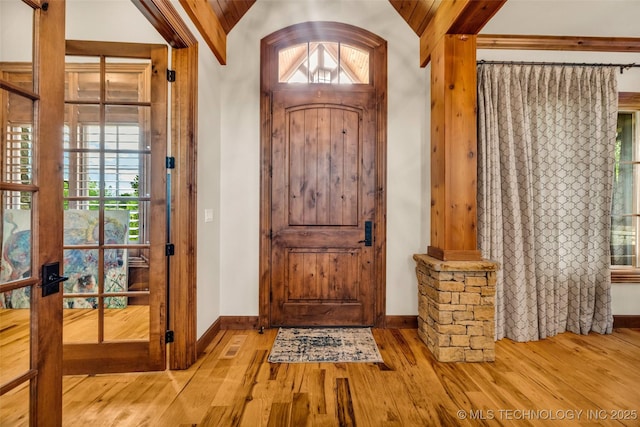 13533 S Lewis Ave, Bixby, OK 74008 - entryway featuring vaulted ceiling, wood finished floors, and decorative columns