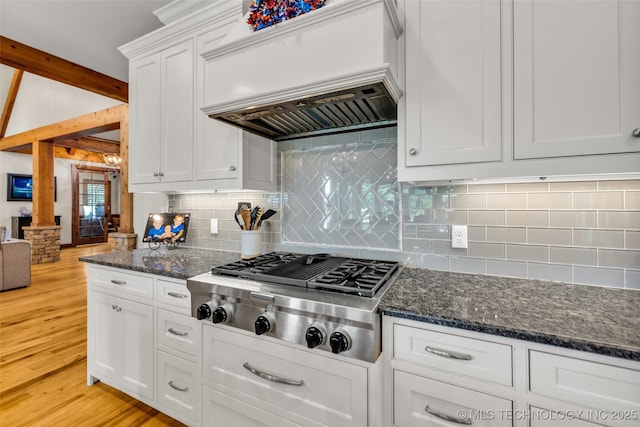 13533 S Lewis Ave, Bixby, OK 74008 - kitchen with stainless steel gas stovetop, custom range hood, white cabinets, and backsplash