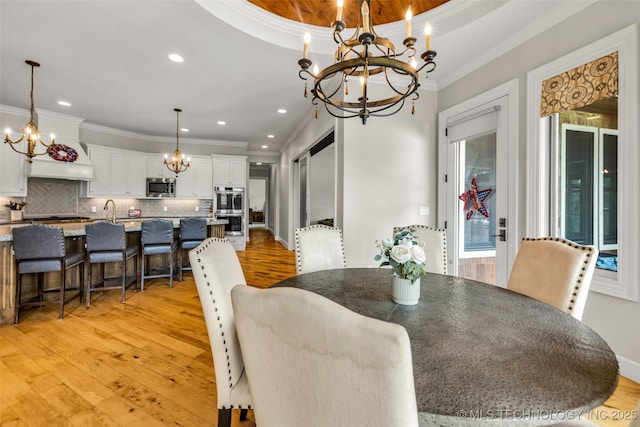 13533 S Lewis Ave, Bixby, OK 74008 - dining area featuring a chandelier, crown molding, light wood-style floors, and recessed lighting