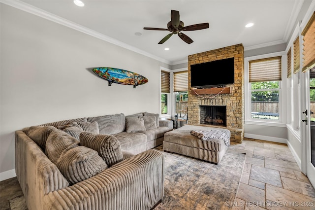13533 S Lewis Ave, Bixby, OK 74008 - living area featuring stone tile flooring, crown molding, recessed lighting, a stone fireplace, and a ceiling fan