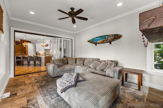 13533 S Lewis Ave, Bixby, OK 74008 - living area featuring stone tile flooring, a ceiling fan, recessed lighting, crown molding, and a chandelier