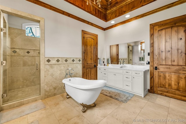 13533 S Lewis Ave, Bixby, OK 74008 - bathroom with vanity, a stall shower, a freestanding bath, tile patterned flooring, and ornamental molding