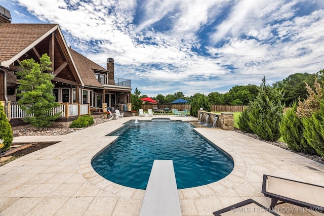 13533 S Lewis Ave, Bixby, OK 74008 - swimming pool featuring a patio area and a diving board
