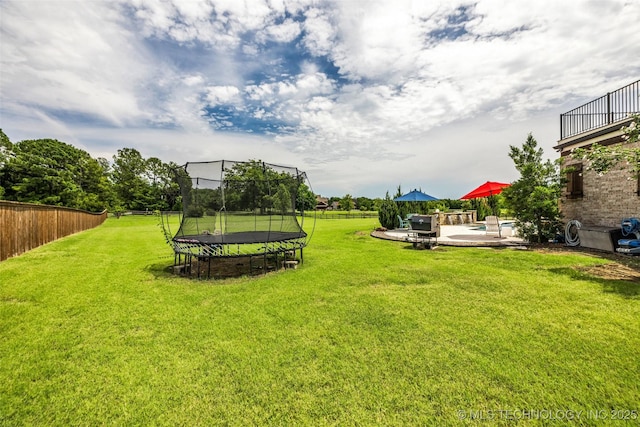 13533 S Lewis Ave, Bixby, OK 74008 - view of yard with a trampoline, a patio, and a pool