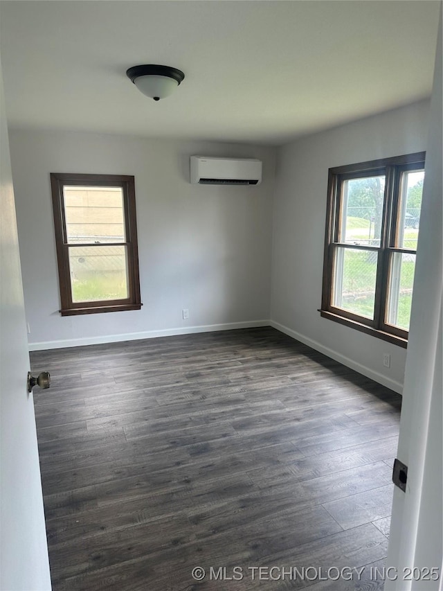518 N Franklin Ave, Sand Springs, OK 74063 - unfurnished room with a wall mounted air conditioner and dark wood-style floors