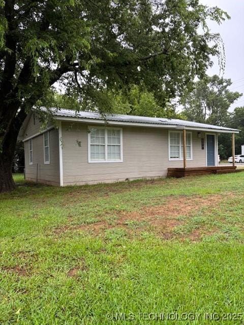 1200 S Mckinley Ave, Calera, OK 74730 - view of side of home with a yard