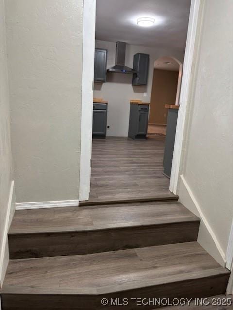 1200 S Mckinley Ave, Calera, OK 74730 - stairway with wood finished floors and arched walkways