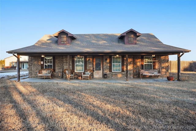 740384 S 3480th Rd, Cushing, OK 74023 - view of front facade with covered porch, roof with shingles, and stone siding