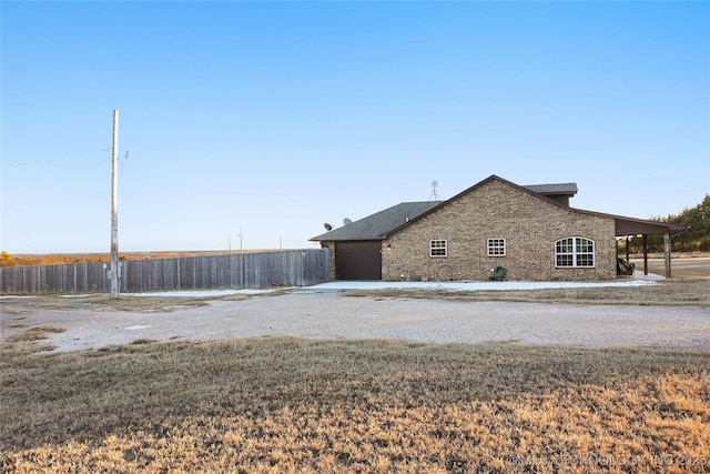 740384 S 3480th Rd, Cushing, OK 74023 - view of home's exterior featuring concrete driveway, an attached garage, and brick siding